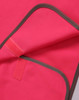 A bright pink safety vest with contrasting grey trim and a Velcro closure. It features a logo on the fabric.