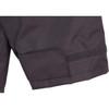 A close-up of a black safety jacket featuring a Velcro patch and reflective 3M tape accents.