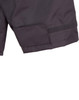 A close-up of a black safety jacket featuring a Velcro patch and reflective 3M tape accents.