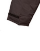 A close-up of a dark-coloured quilted safety jacket featuring a velcro strap on the sleeve.