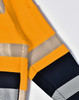A bright yellow work jumper featuring reflective stripes and a dark navy blue lower section. Includes a logo.