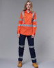 A high-visibility orange work shirt with reflective stripes, paired with dark navy pants and work boots.