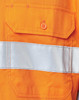 An orange safety shirt featuring a reflective silver tape and a pocket with an orange button.