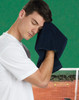 A man in a white shirt wipes his forehead with a dark navy hand towel, set against a green background.