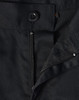 A close-up of black unisex utility stretch cargo work pants, featuring a button and zip closure.