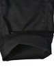 A pair of black cargo pants showcasing a folded cuff, featuring a durable fabric and a branded label.
