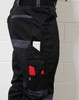 A pair of black unisex utility stretch cargo work pants with multiple pockets, including tool holders and a logo.