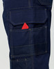 Navy blue semi-fitted Cordura work pants featuring multiple pockets, including a visible pocket with a red item.
