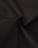 A close-up of black cotton fabric, showcasing a smooth texture and slight stretch. The material appears to be durable.
