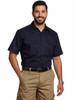 A navy short-sleeved cotton work shirt with two chest pockets, worn by a smiling man.