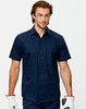 A navy short-sleeved work shirt with two chest pockets and a logo, worn by a man wearing glasses and gloves.