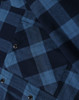 A unisex flannel plaid shirt in navy and blue tones, featuring button-up design and a chest pocket.