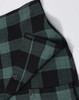 A unisex flannel plaid shirt featuring green and black checks, with buttons and a small pocket detail.