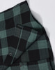 A unisex flannel plaid shirt featuring green and black check patterns, with button-up details and a logo.