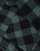 A close-up of a unisex flannel plaid shirt featuring a black and dark green check pattern with button details.