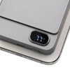 A grey magnetic wireless power bank with a digital battery indicator, resting on a phone.