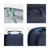 A pencil case in dark blue fabric featuring multiple compartments, a handle, and green scissors inside.