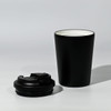 A black travel cup with a removable lid, featuring a sleek design and a contrasting inner colour.