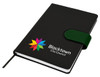 A black Cordoba A5 notebook with a green elastic band and a logo on the cover.