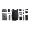 A black Bellroy Via Backpack 20L surrounded by a laptop, drink bottle, sunglasses, and various accessories.