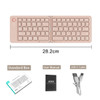 A wireless foldable keyboard in a light pink shade, accompanied by a user manual and USB-C cable.
