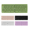 A wireless foldable keyboard in green, pink, black, and white, featuring a logo and an ergonomic design.