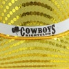 A shiny yellow sequin cowboy hat with a white band featuring a logo.