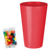 A red party cup next to a packet of colourful jelly beans featuring various shades and patterns.