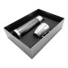 A drink bottle in black and a silver cup, both presented in a sleek gift box with foam cushioning.