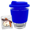 A blue reusable coffee cup with a silicone sleeve and a packet of jelly candy beside it. The cup has a logo.