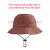 A foldable bucket hat in a warm terracotta colour, featuring a chin strap and a branding logo.