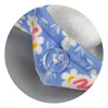 A blue hair towel with a floral pattern and a button closure, made of soft, absorbent material.