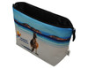 A toiletry bag featuring a scenic beach design with a kangaroo, primarily in blue and white tones, with a logo.