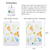 A white golf towel featuring colourful foot and wave designs, with a hook for easy attachment.
