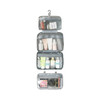 A large capacity hanging toiletry bag in grey, featuring multiple transparent compartments filled with various toiletries.