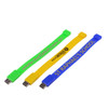 Three rectangular silicone wristband flash drives in bright green, yellow, and blue, each with a logo or branding.