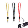 Three lanyard flash drives in yellow, black, and red, featuring clips and a USB connector. Each has a logo.
