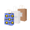 Three kraft paper bags with twisted handles: one blue with planet and star patterns, one white with a logo, and one plain brown.