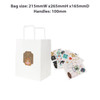 A white kraft paper bag with flat handles and assorted colourful stickers beside it.