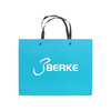 A turquoise knitted handle bag with a laminated finish and a logo. It features two black handles.