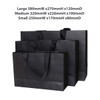 A set of black paper bags with flat handles in three sizes: small, medium, and large. Each bag has a logo.