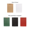 A large vertical paper bag in various colours: brown, white, green, black, and red, with a fabric flat handle.