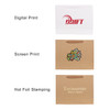 A medium crosswise paper bag in brown with a fabric flat handle and various printed designs.