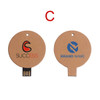 A round, eco-friendly flash drive in brown cardboard with logos on both sides, featuring a black USB connector.