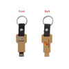 An eco-friendly mini flash drive keychain in brown with a black keyring, featuring logos on both sides.