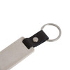 An eco-friendly mini flash drive keychain in beige with a black leather loop and a silver metal ring.