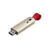 A sliding metal flash drive in gold with a red strap. The drive has a button for easy access.