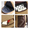 A tan canvas laptop backpack featuring multiple compartments, including a padded interior and a pocket for accessories.
