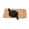 A black ZIP 60W fast charging cable with retractable design, placed on brown packaging. Contains a logo.