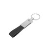 A PU leather keyring in black with a metal attachment and a circular keyring. Features a logo on the metal part.